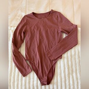 a new day bodysuit